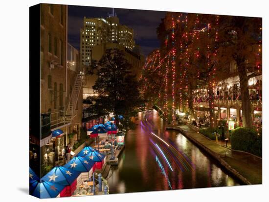 Restaurant Along a River Lit Up at Dusk, San Antonio River, San Antonio, Texas, USA-null-Stretched Canvas