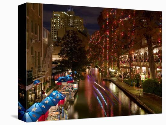 Restaurant Along a River Lit Up at Dusk, San Antonio River, San Antonio, Texas, USA-null-Stretched Canvas