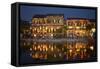 Restaurants and tourists reflected in Thu Bon River at dusk, Hoi An, Vietnam-David Wall-Framed Stretched Canvas