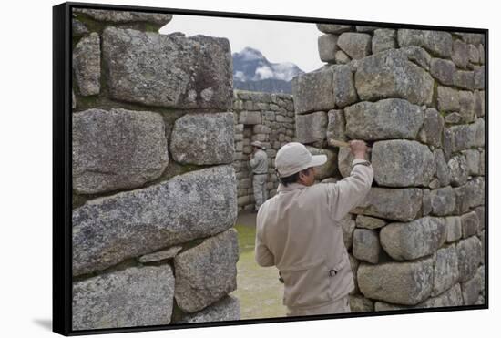 Restoration work at the Inca ruins of Machu Picchu, UNESCO World Heritage Site, Peru, South America-Julio Etchart-Framed Stretched Canvas