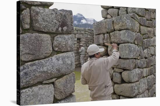 Restoration work at the Inca ruins of Machu Picchu, UNESCO World Heritage Site, Peru, South America-Julio Etchart-Stretched Canvas