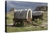 Restored Covered Wagons (Conestoga Wagon at Rear), at Scotts Bluff on the Oregon Trail in Nebraska-null-Stretched Canvas