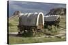 Restored Covered Wagons (Conestoga Wagon at Rear), at Scotts Bluff on the Oregon Trail in Nebraska-null-Stretched Canvas