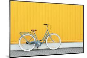 Retro Bicycle near Yellow Wall Outdoors-Africa Studio-Mounted Photographic Print