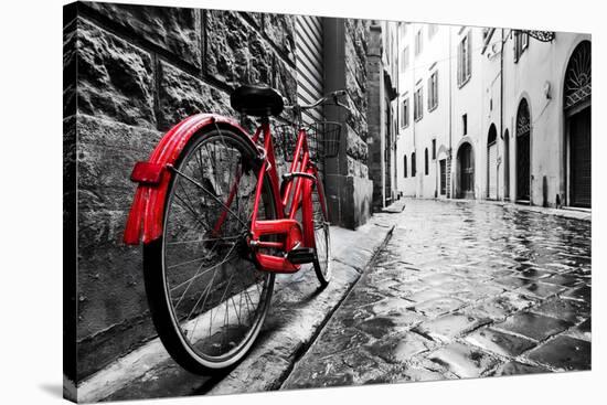 Retro Vintage Red Bike on Cobblestone Street in the Old Town. Color in Black and White. Old Charmin-Michal Bednarek-Stretched Canvas