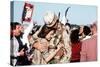 Returning US Soldier Hugs Loved One Amid Other Celebrating Families and Friends-null-Stretched Canvas