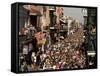 Revelers Pack the French Quarter's Famous Bourbon Street During the Annual Mardi Gras Celebration-null-Framed Stretched Canvas