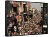 Revelers Pack the French Quarter's Famous Bourbon Street During the Annual Mardi Gras Celebration-null-Framed Stretched Canvas