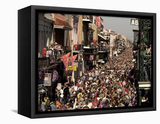 Revelers Pack the French Quarter's Famous Bourbon Street During the Annual Mardi Gras Celebration-null-Framed Stretched Canvas