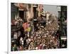 Revelers Pack the French Quarter's Famous Bourbon Street During the Annual Mardi Gras Celebration-null-Framed Photographic Print