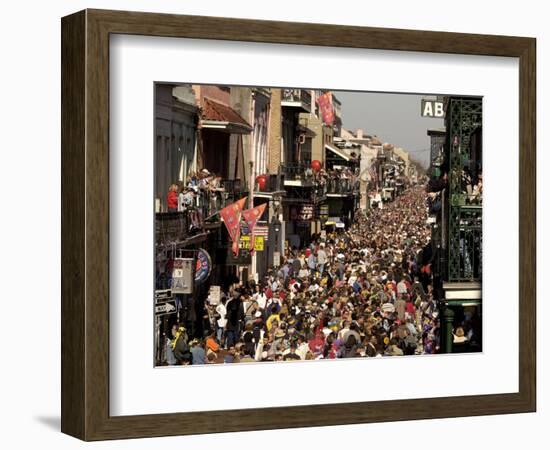 Revelers Pack the French Quarter's Famous Bourbon Street During the Annual Mardi Gras Celebration-null-Framed Photographic Print