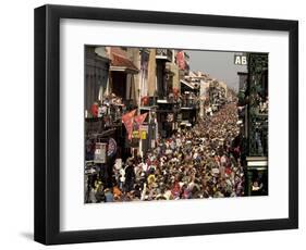 Revelers Pack the French Quarter's Famous Bourbon Street During the Annual Mardi Gras Celebration-null-Framed Photographic Print