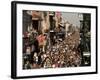 Revelers Pack the French Quarter's Famous Bourbon Street During the Annual Mardi Gras Celebration-null-Framed Photographic Print