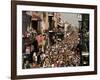 Revelers Pack the French Quarter's Famous Bourbon Street During the Annual Mardi Gras Celebration-null-Framed Photographic Print