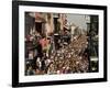 Revelers Pack the French Quarter's Famous Bourbon Street During the Annual Mardi Gras Celebration-null-Framed Photographic Print