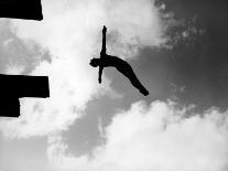 Excellent of Man Silhouetted Against Sky Doing Back Dive Off High Board-Rex Hardy Jr.-Photographic Print