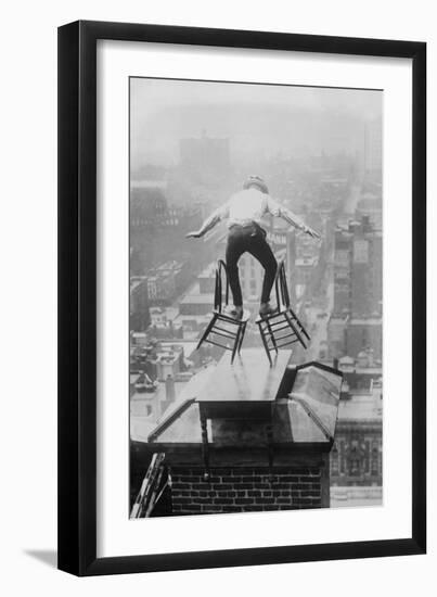 Reynolds Performs a Balancing Act on Roof in New York City-null-Framed Art Print