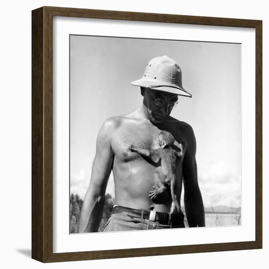 Rhesus Monkey Climbing on a Man's Chest at a Monkey Colony-Hansel Mieth-Framed Premium Photographic Print