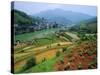 Rice Paddies and Brick-Maker at Longsheng in Northeast Guangxi Province, China-Robert Francis-Stretched Canvas