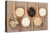 Rice Varieties In Olive Wood Spoons Over Hessian Background-marilyna-Stretched Canvas