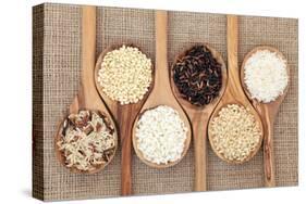 Rice Varieties In Olive Wood Spoons Over Hessian Background-marilyna-Stretched Canvas