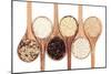 Rice Varieties In Olive Wood Spoons Over White Background-marilyna-Mounted Art Print