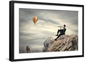 Rich Businessman Sitting On A Chair In The Mountain Looking The Landscape With Spyglass-olly2-Framed Art Print