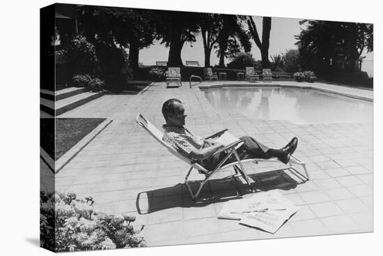 Richard Nixon Reading Newspapers While Sitting by the Pool in San Clemente, Ca. 1969-74-null-Stretched Canvas