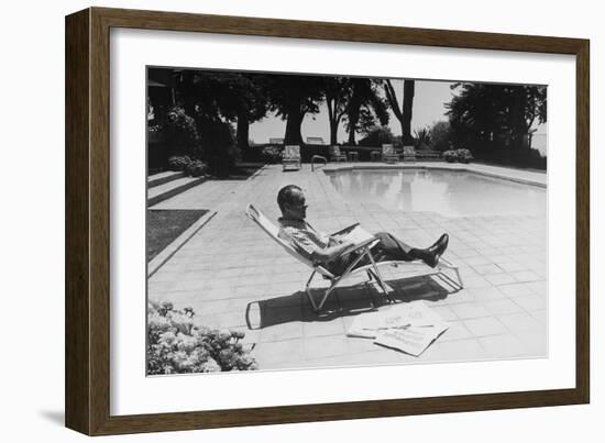 Richard Nixon Reading Newspapers While Sitting by the Pool in San Clemente, Ca. 1969-74-null-Framed Photo