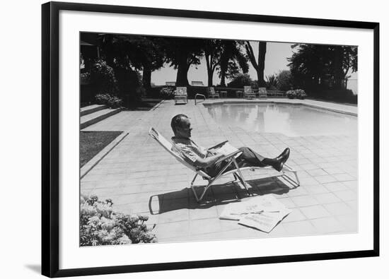 Richard Nixon Reading Newspapers While Sitting by the Pool in San Clemente, Ca. 1969-74-null-Framed Photo