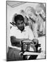Richard 'Pancho' Gonzales Restringing a Tennis Racket in 1962-null-Mounted Photo