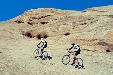 Side profile of two men mountain bilking on rocks, Slickrock Trail, Moab, Utah, USA-Richard Sisk-Framed Photographic Print