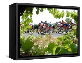 Riders are Seen Through Vineyards as the Pack Pedals Outside Beziers-null-Framed Stretched Canvas