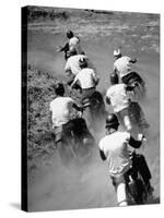 Riders Enjoying Motorcycle Racing, Leaving a Trail of Dust Behind-Loomis Dean-Stretched Canvas
