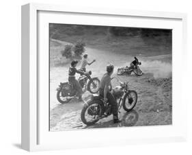 Riders Enjoying Motorcycle Riding, with One Taking a Spill-Loomis Dean-Framed Photographic Print