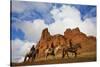 Riders Passing under the Red Rock Hills of the Big Horn Mountains-Terry Eggers-Stretched Canvas