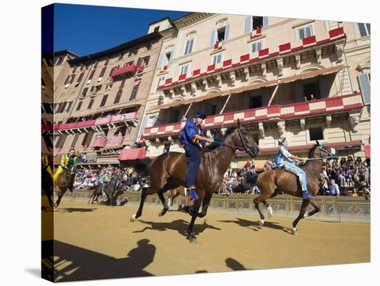 Riders Racing at El Palio Horse Race Festival, Piazza Del Campo, Siena, Tuscany, Italy, Europe-Christian Kober-Stretched Canvas
