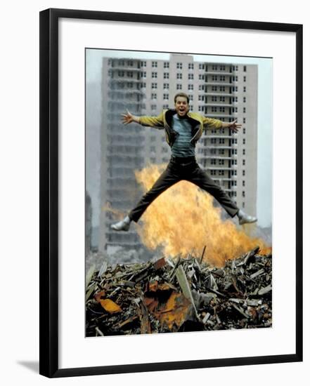 Riff Leaps over Smoldering Rubble of New York Slum Clearance Project in Scene from West Side Story-Gjon Mili-Framed Premium Photographic Print