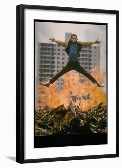 Riff Leaps over Smoldering Rubble of New York Slum Clearance Project in Scene from West Side Story-Gjon Mili-Framed Photographic Print