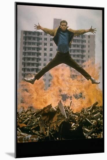 Riff Leaps over Smoldering Rubble of New York Slum Clearance Project in Scene from West Side Story-Gjon Mili-Mounted Photographic Print