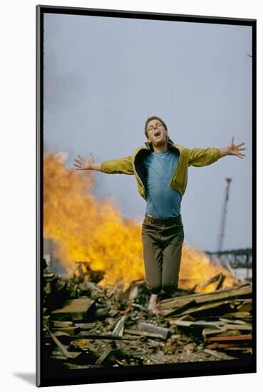 Riff Leaps over Smoldering Rubble, Scene from West Side Story-Gjon Mili-Mounted Photographic Print