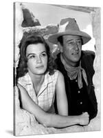 RIO BRAVO, 1959 directed by HOWARD HAWKS On the set, Angie Dickinson and John Wayne (b/w photo)-null-Stretched Canvas