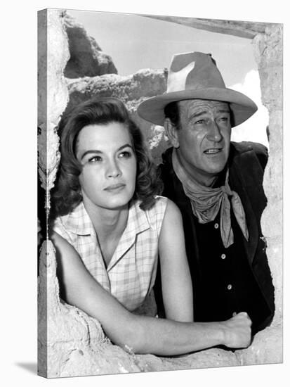 RIO BRAVO, 1959 directed by HOWARD HAWKS On the set, Angie Dickinson and John Wayne (b/w photo)-null-Stretched Canvas