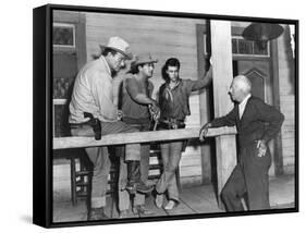 RIO BRAVO, 1959 directed by HOWARD HAWKS On the set, John Wayne, Dean Martin and Ricky Nelson with -null-Framed Stretched Canvas