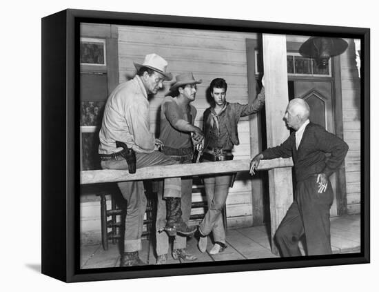 RIO BRAVO, 1959 directed by HOWARD HAWKS On the set, John Wayne, Dean Martin and Ricky Nelson with -null-Framed Stretched Canvas