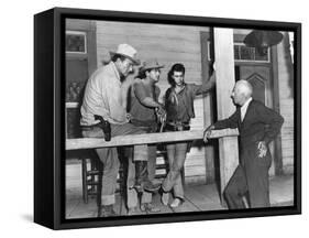 RIO BRAVO, 1959 directed by HOWARD HAWKS On the set, John Wayne, Dean Martin and Ricky Nelson with -null-Framed Stretched Canvas