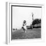 Rita Giannuzzi Poses Smiling on the Road Observed by a Man Passing on a Motorbike-null-Framed Photographic Print