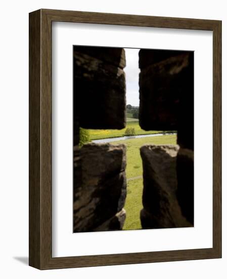 River Aln Seen Through Arrow Slit of Walls of Alnwick Castle, Northumberland, England-Nick Servian-Framed Photographic Print