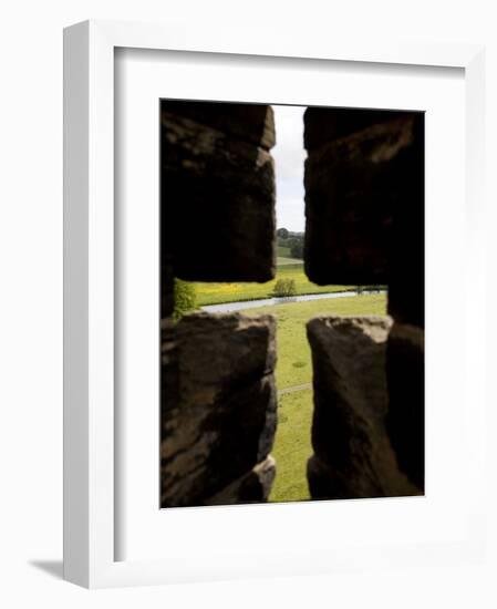 River Aln Seen Through Arrow Slit of Walls of Alnwick Castle, Northumberland, England-Nick Servian-Framed Photographic Print