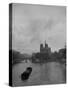 River Barge Churning up the Seine Past Notre Dame Cathedral on a Gloomy Winter Day-Ed Clark-Stretched Canvas